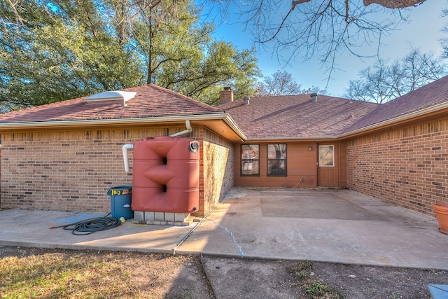 doorway to property with a patio