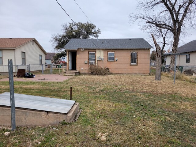 13 E 18th St, San Angelo, TX 76903 - back of property featuring a shingled roof