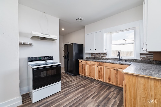 415 E Harris Ave, San Angelo, TX 79903 - kitchen featuring electric range, black fridge, extractor fan, dark wood-style floors, and dark countertops