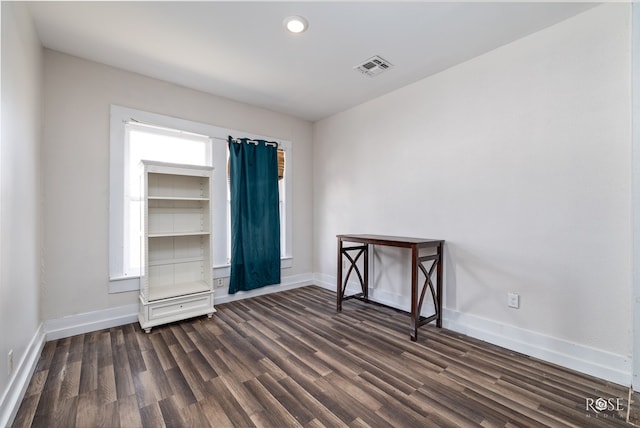 415 E Harris Ave, San Angelo, TX 79903 - unfurnished room with dark wood-style floors and recessed lighting