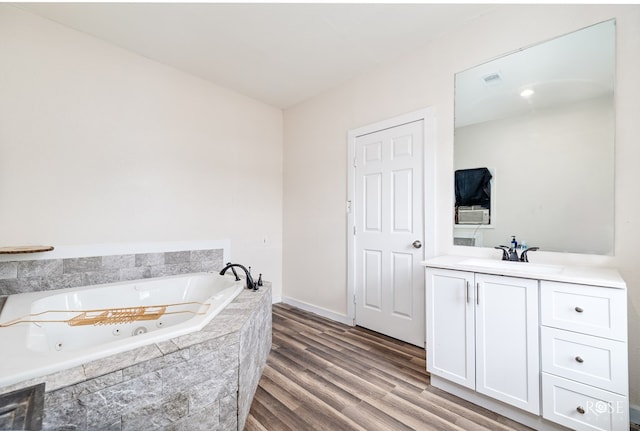415 E Harris Ave, San Angelo, TX 79903 - full bath with a whirlpool tub, vanity, and wood finished floors