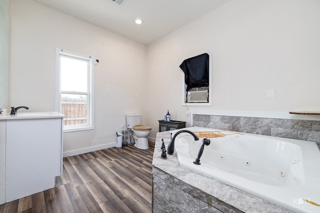 415 E Harris Ave, San Angelo, TX 79903 - full bathroom with vanity, a jetted tub, wood finished floors, and recessed lighting