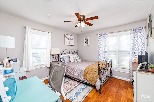 bedroom featuring hardwood / wood-style flooring and ceiling fan