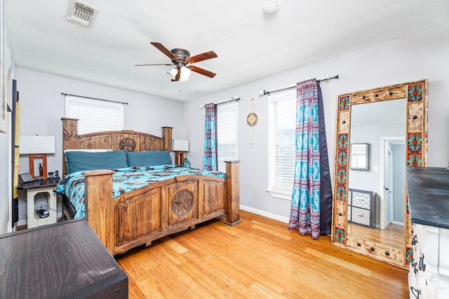 bedroom featuring light hardwood / wood-style floors and ceiling fan