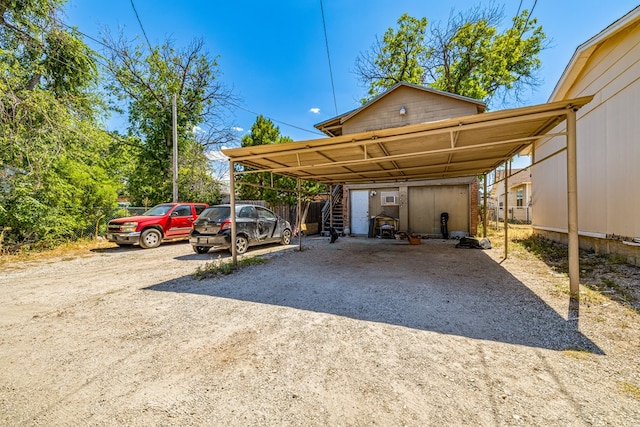 view of vehicle parking featuring a carport