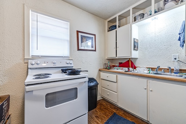 kitchen featuring white cabinetry, sink, dark wood-type flooring, a textured ceiling, and electric stove