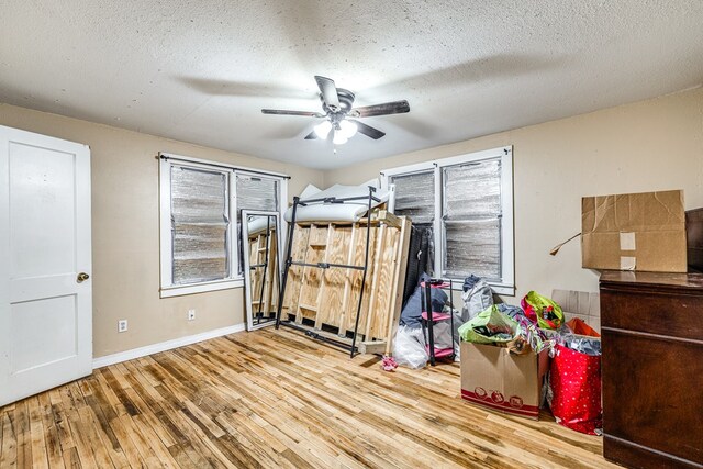 bedroom featuring hardwood / wood-style floors and a textured ceiling