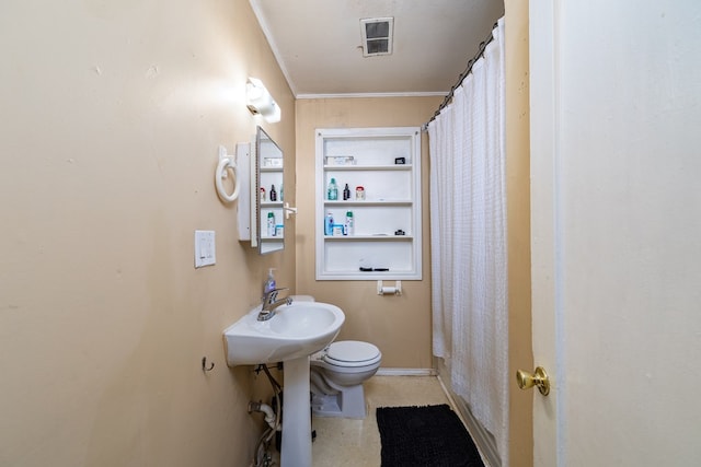 bathroom with crown molding and toilet