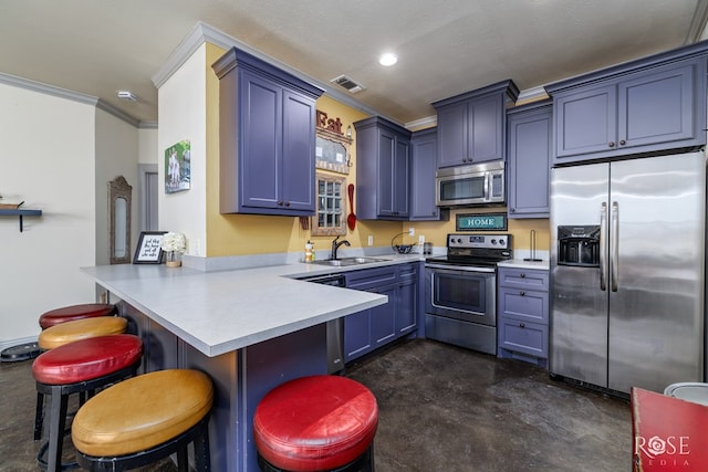 kitchen featuring stainless steel appliances, light countertops, visible vents, a sink, and a peninsula