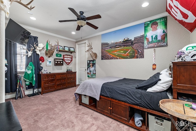 bedroom with crown molding, a textured wall, a ceiling fan, and light colored carpet