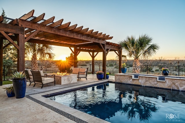 view of pool with a fire pit, a patio area, and a pergola