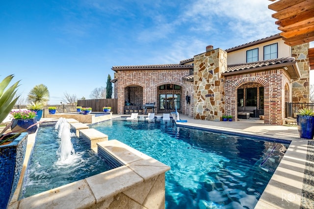 view of swimming pool featuring a patio, fence, and a fenced in pool