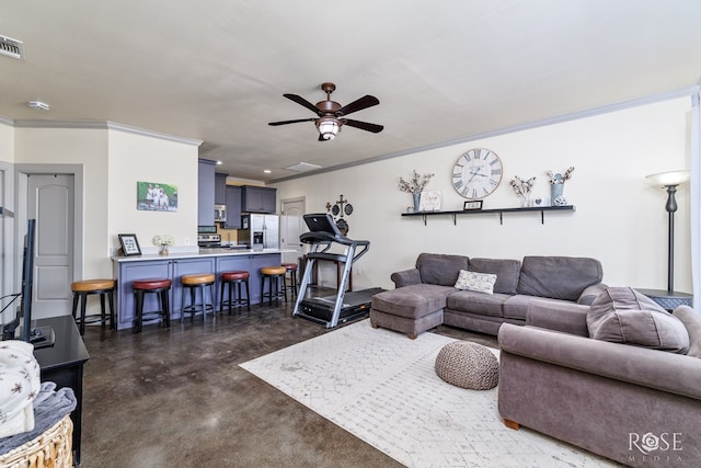 living room with finished concrete floors, crown molding, ceiling fan, and visible vents