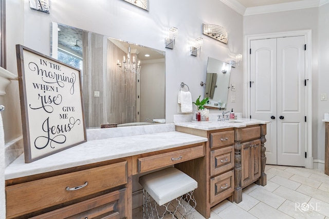 bathroom featuring a notable chandelier, vanity, a closet, tile patterned floors, and crown molding