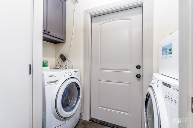 laundry area featuring washer / dryer and cabinet space