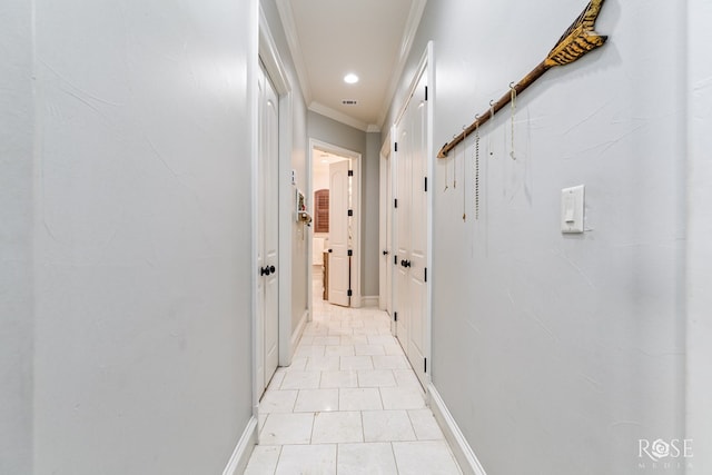 hallway with baseboards, crown molding, and recessed lighting