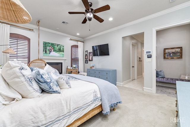 bedroom with ornamental molding, light colored carpet, visible vents, and baseboards