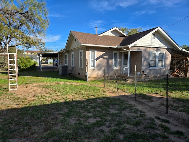 view of home's exterior featuring a carport, a lawn, and central air condition unit