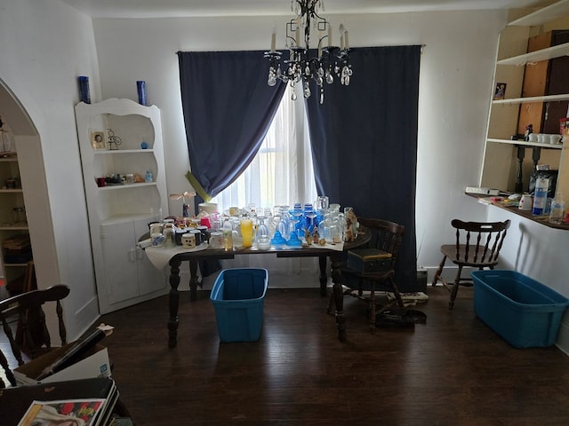 sitting room featuring a notable chandelier and dark hardwood / wood-style flooring