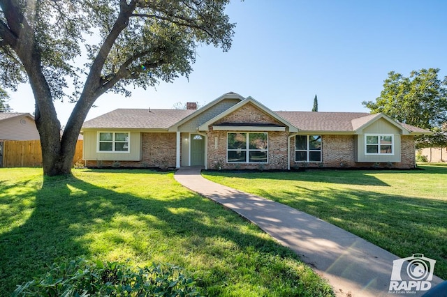 ranch-style house featuring a front yard