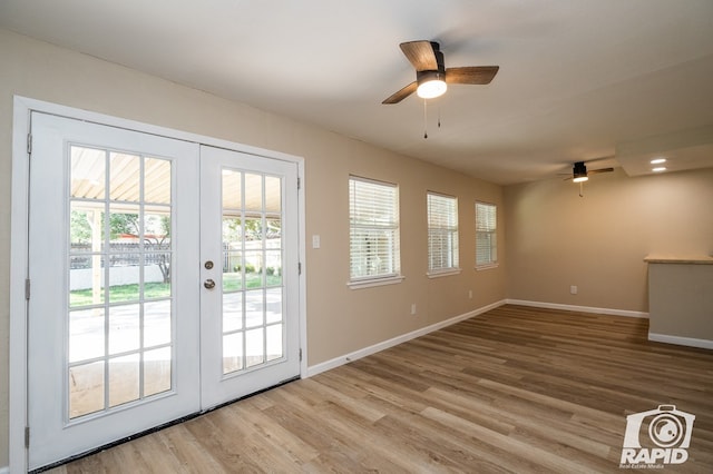 doorway to outside featuring light hardwood / wood-style floors, french doors, and ceiling fan