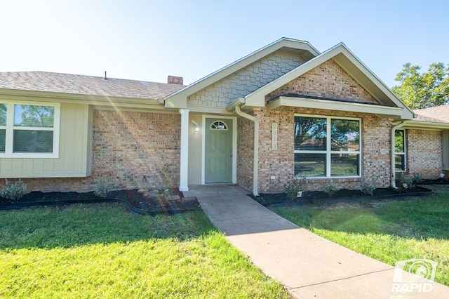 view of front of home with a front lawn