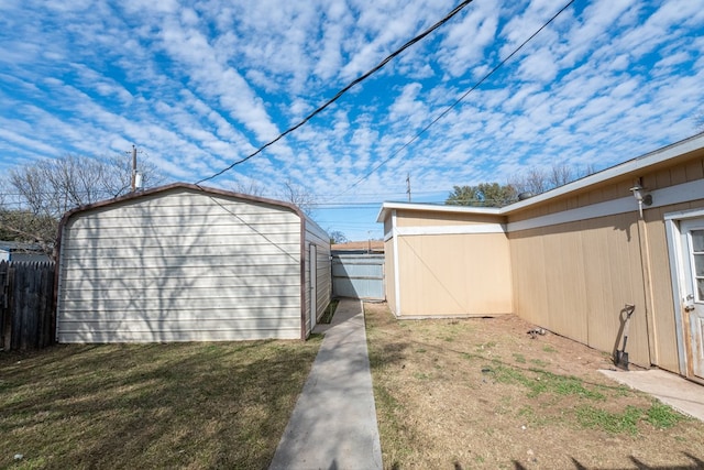 view of outbuilding with a lawn