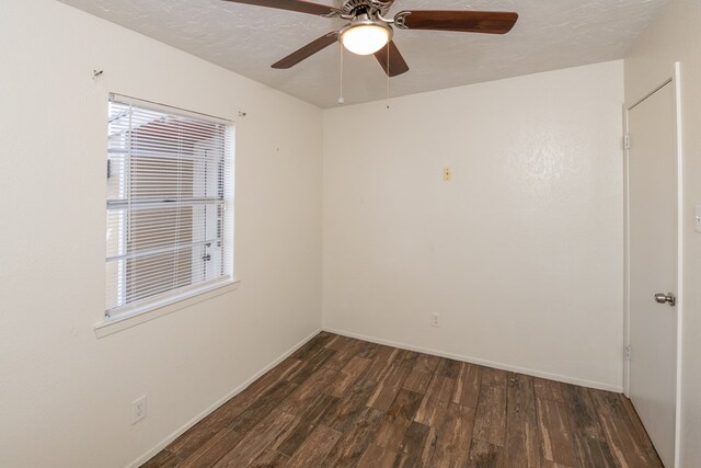 unfurnished room featuring dark hardwood / wood-style flooring