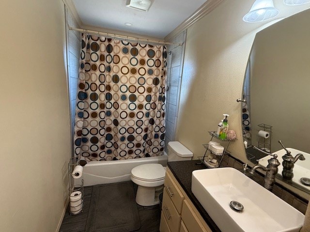 bathroom featuring toilet, shower / bath combo with shower curtain, and vanity