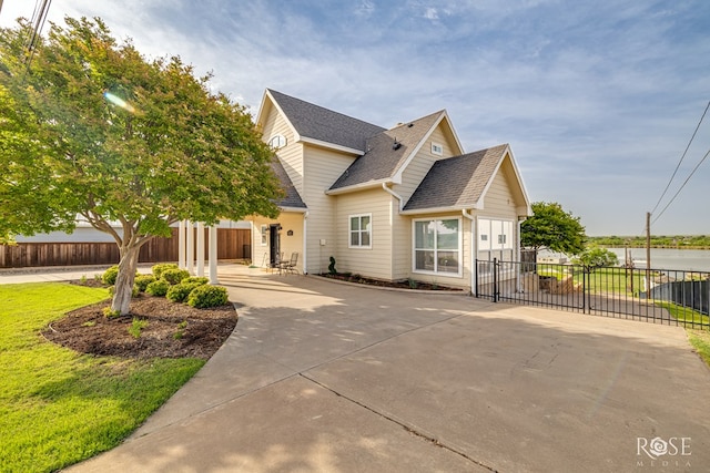 3045 Red Bluff Cir, San Angelo, TX 76904 - traditional-style house featuring roof with shingles and concrete driveway