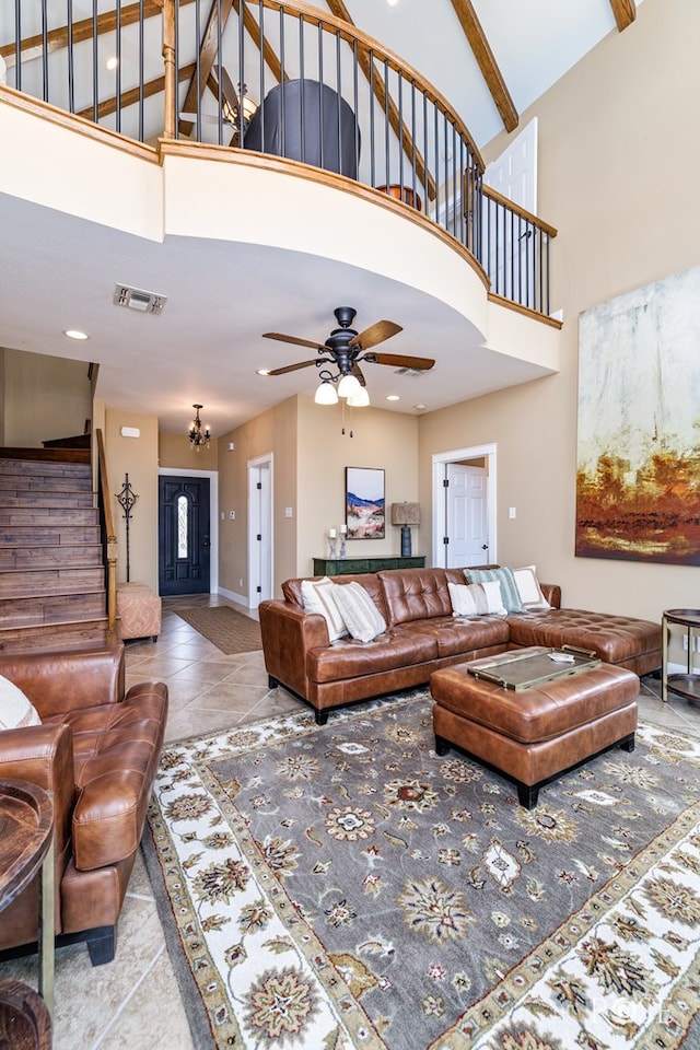 3045 Red Bluff Cir, San Angelo, TX 76904 - living area with stairs, high vaulted ceiling, a ceiling fan, baseboards, and tile patterned floors