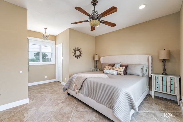 3045 Red Bluff Cir, San Angelo, TX 76904 - tiled bedroom featuring a chandelier, baseboards, recessed lighting, and ceiling fan