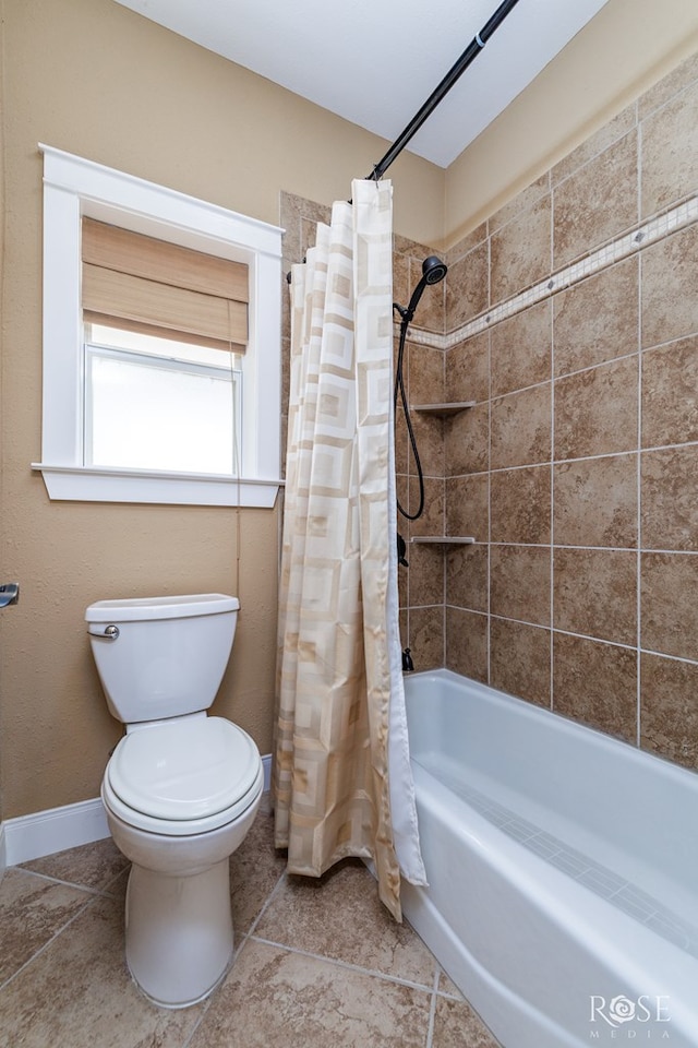 3045 Red Bluff Cir, San Angelo, TX 76904 - bathroom with toilet, baseboards, shower / bath combination with curtain, and tile patterned flooring