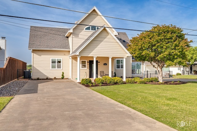 3045 Red Bluff Cir, San Angelo, TX 76904 - view of front of house featuring a shingled roof, covered porch, central AC, and driveway