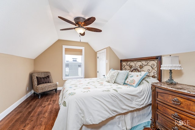 3045 Red Bluff Cir, San Angelo, TX 76904 - bedroom with dark wood-type flooring, baseboards, lofted ceiling, and a ceiling fan