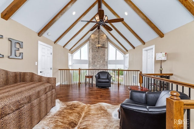 3045 Red Bluff Cir, San Angelo, TX 76904 - living area featuring a ceiling fan, high vaulted ceiling, beam ceiling, wood finished floors, and baseboards