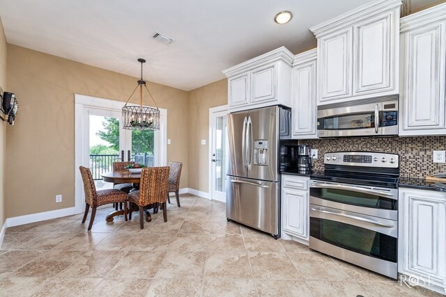 3045 Red Bluff Cir, San Angelo, TX 76904 - kitchen with stainless steel appliances, dark countertops, a chandelier, baseboards, and backsplash