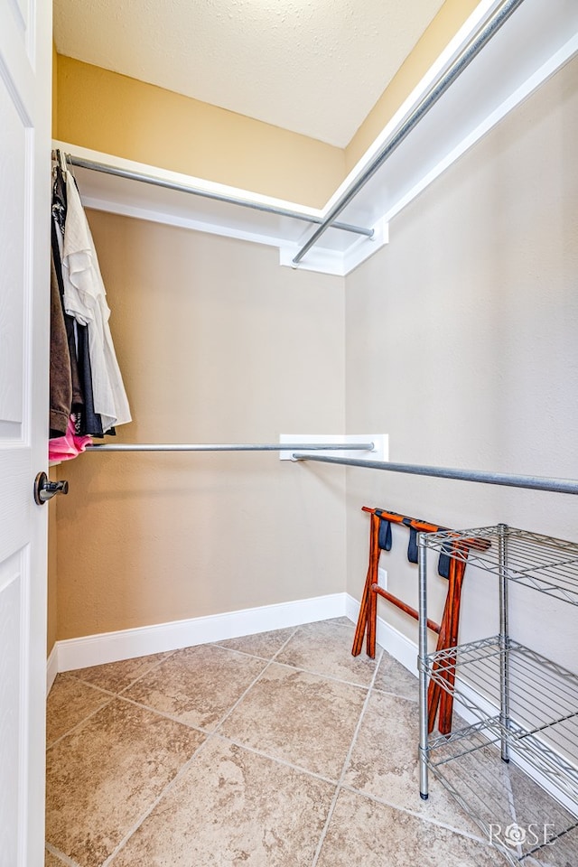 3045 Red Bluff Cir, San Angelo, TX 76904 - walk in closet with tile patterned floors