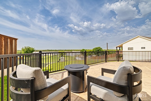 3045 Red Bluff Cir, San Angelo, TX 76904 - wooden deck with an outdoor fire pit and a lawn