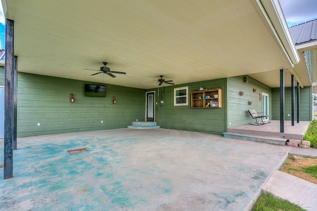 view of patio / terrace featuring ceiling fan and a carport