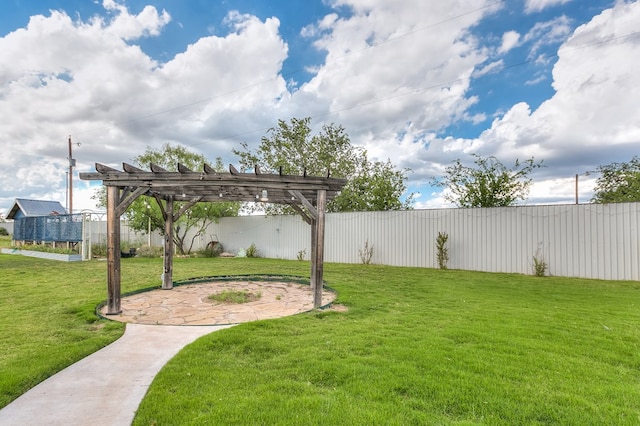 view of yard featuring fence and a pergola