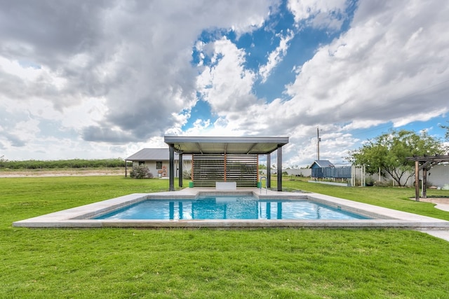 outdoor pool featuring a yard