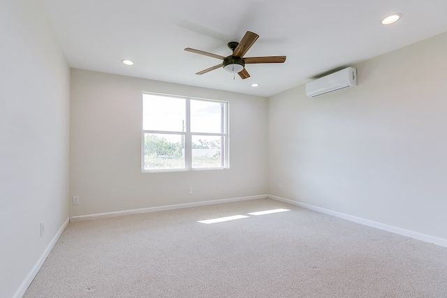 unfurnished room featuring recessed lighting, an AC wall unit, and baseboards