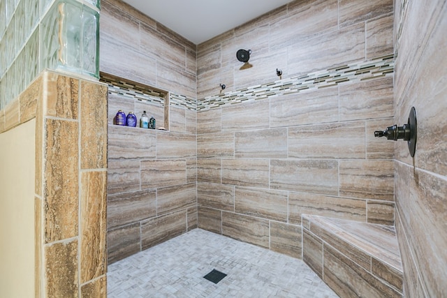 bathroom featuring tiled shower