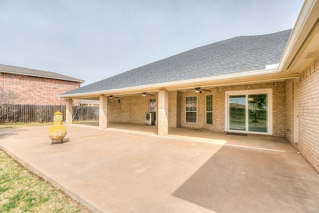 view of patio / terrace featuring fence and a ceiling fan