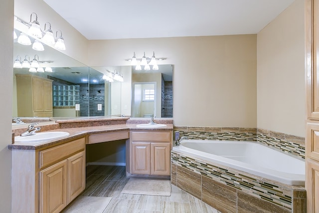 full bath featuring double vanity, a garden tub, and a sink