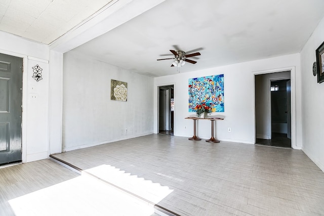 interior space featuring ceiling fan