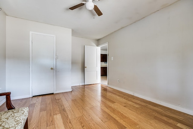 unfurnished bedroom featuring a closet, ceiling fan, and light wood-type flooring