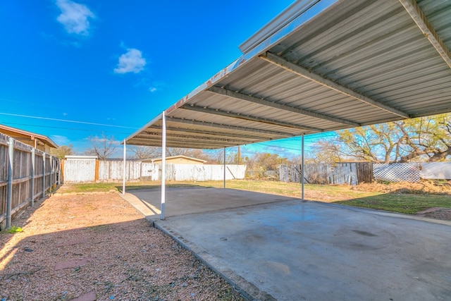 exterior space with a carport