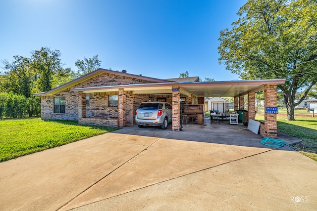 view of front of property with a carport and a front yard